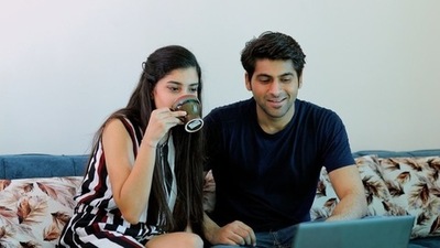 Parents meeting online for a consultation about confidence coaching programs for their child.